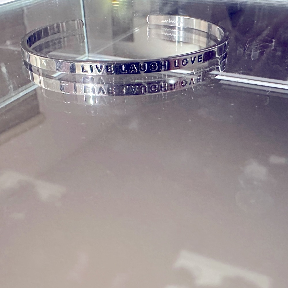 Mantraband “live laugh love” adjustable bangle in silver color